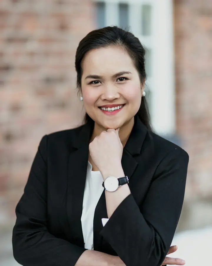 Founder in a blazer, smiling